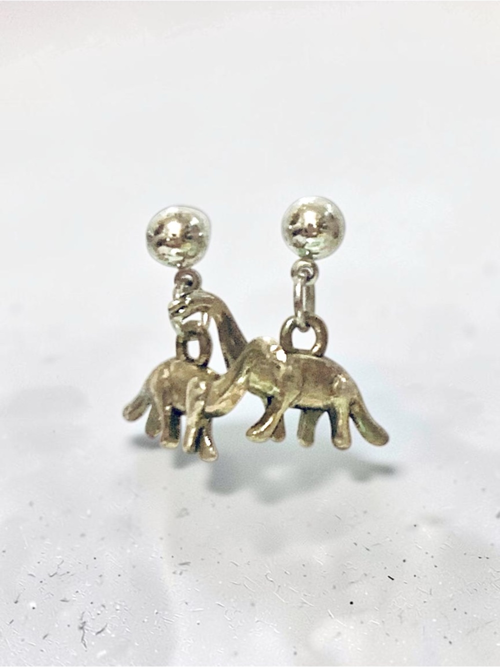 Silver tone Drop brontosaurus stud Earrings